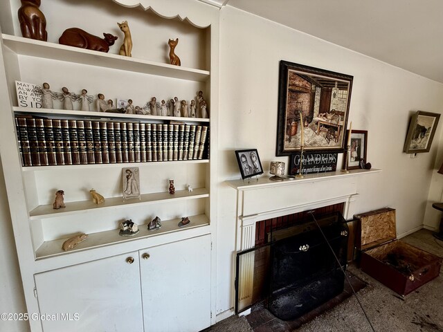 details with built in features and a brick fireplace