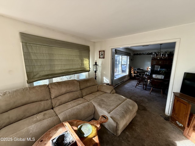 carpeted living room with a healthy amount of sunlight