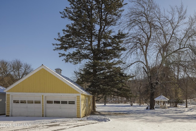 view of snow covered garage