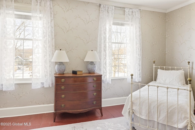 bedroom featuring multiple windows, crown molding, and hardwood / wood-style flooring