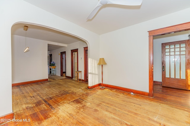 spare room featuring hardwood / wood-style floors and ceiling fan