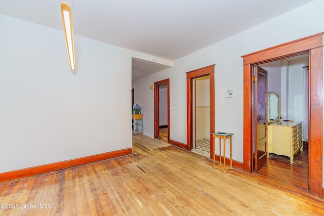 corridor with light hardwood / wood-style flooring