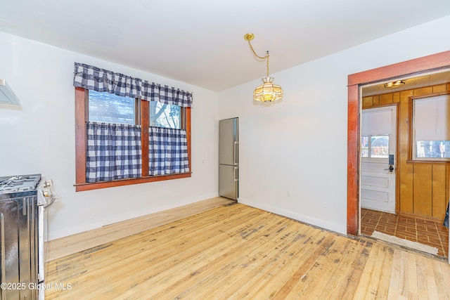 dining room with hardwood / wood-style flooring and plenty of natural light