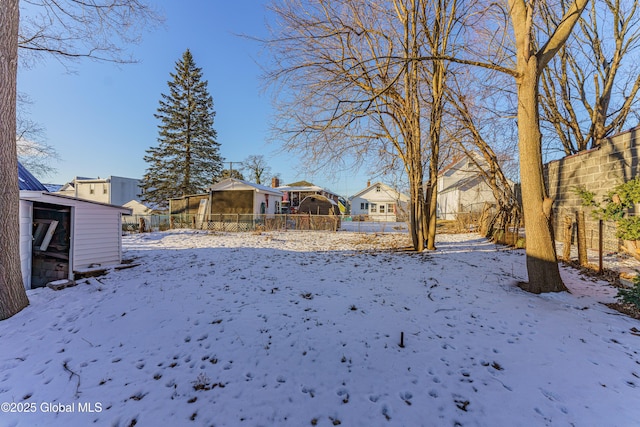 view of yard covered in snow