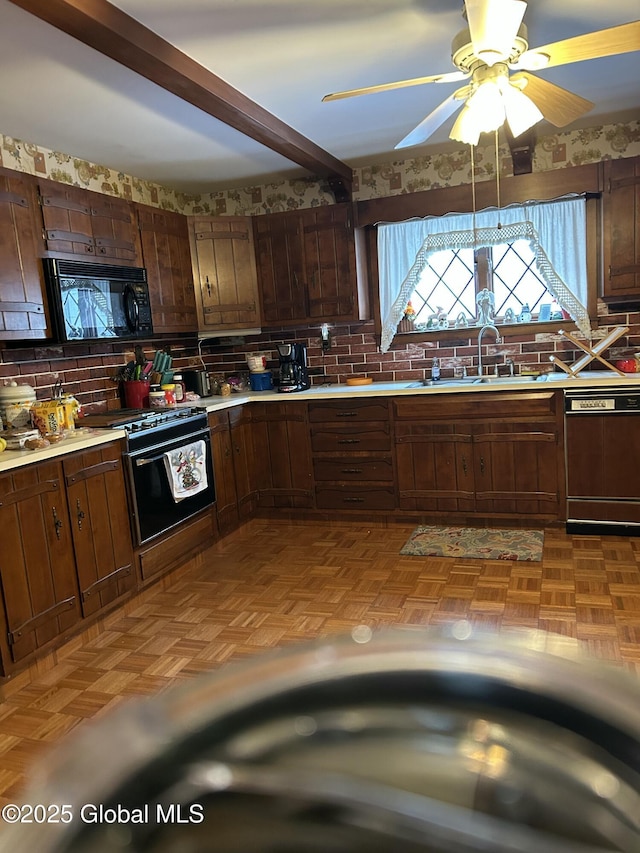 kitchen featuring backsplash, sink, light parquet floors, and black appliances