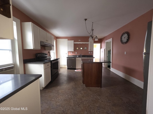 kitchen featuring a kitchen island, appliances with stainless steel finishes, pendant lighting, sink, and white cabinets