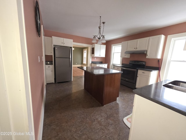 kitchen with a kitchen island, sink, white cabinets, hanging light fixtures, and black appliances