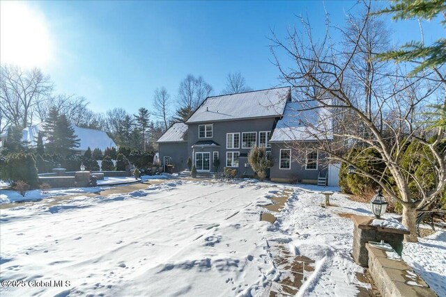 snow covered property featuring a mountain view