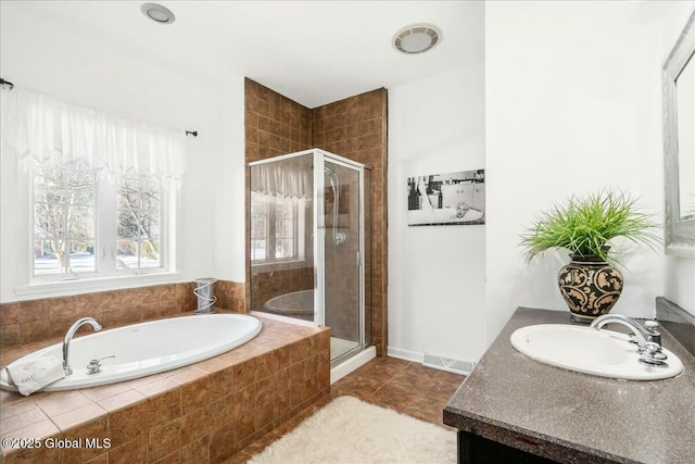 bathroom with vanity, tile patterned floors, and independent shower and bath