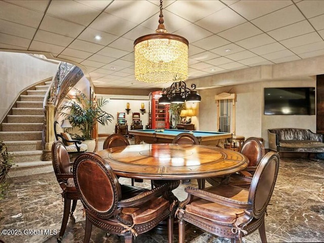 dining space with billiards, stairway, and a drop ceiling