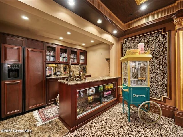 bar with recessed lighting, a raised ceiling, indoor bar, and paneled fridge