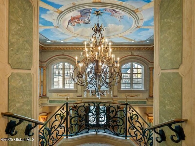 room details with ornamental molding and a notable chandelier