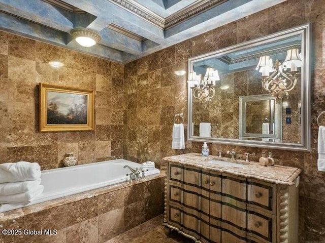 bathroom with a garden tub, tile walls, and vanity