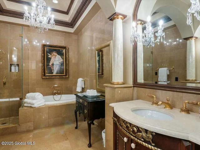 bathroom with a stall shower, tile walls, ornamental molding, ornate columns, and a bath