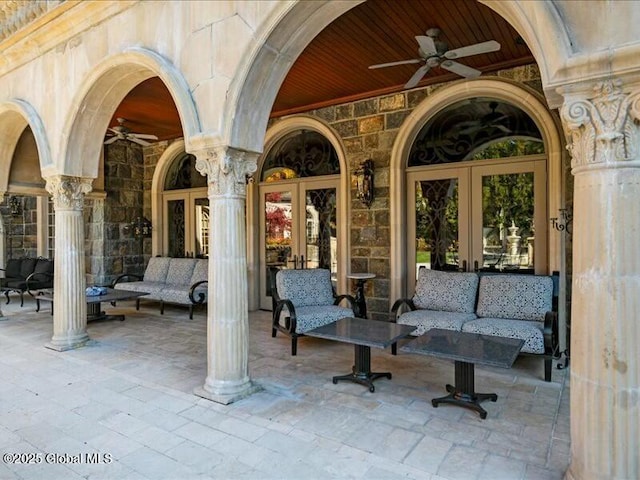 view of patio / terrace featuring an outdoor living space, a ceiling fan, and french doors