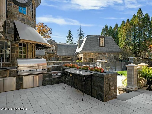 view of patio / terrace with fence, grilling area, and area for grilling