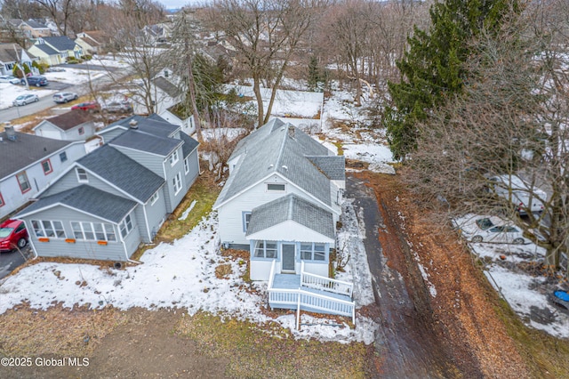 snowy aerial view with a residential view