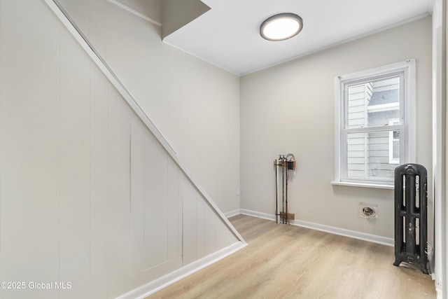 interior space with baseboards and wood finished floors