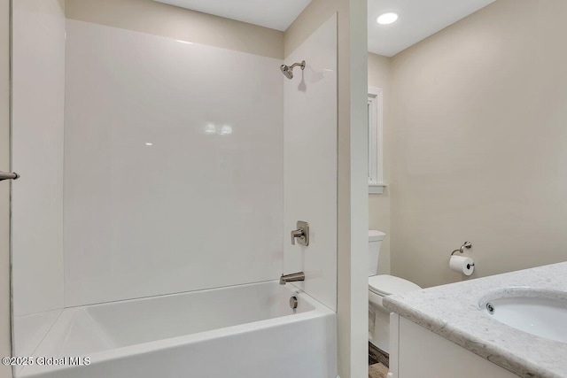 full bath featuring vanity, bathing tub / shower combination, and toilet