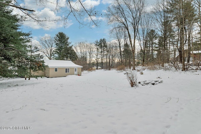 view of yard covered in snow