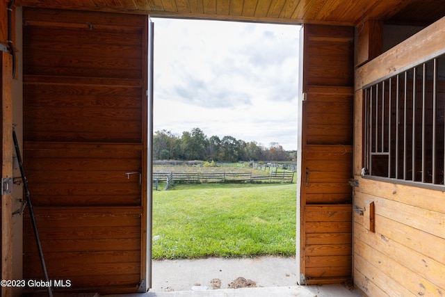 view of stable with a rural view