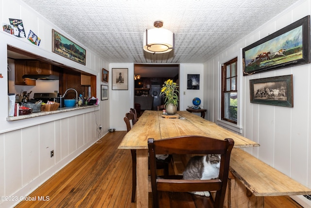 dining area featuring dark hardwood / wood-style flooring and sink