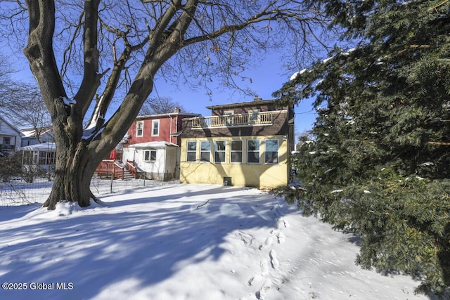 view of front of property with a balcony