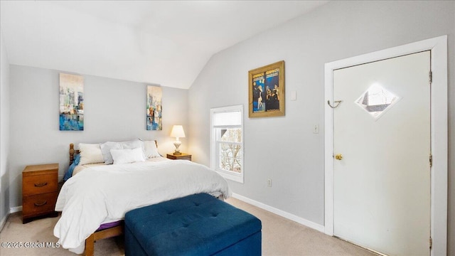 carpeted bedroom featuring vaulted ceiling