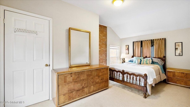 carpeted bedroom with lofted ceiling