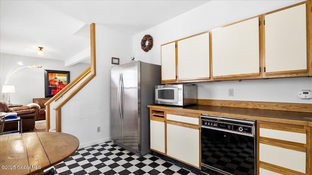 kitchen with stainless steel appliances and white cabinets