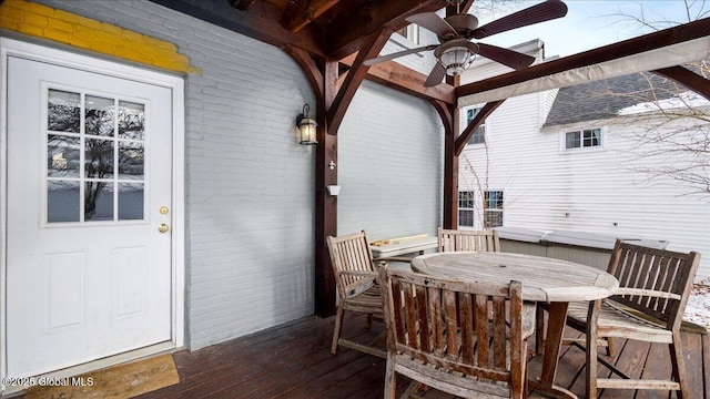 wooden deck featuring ceiling fan