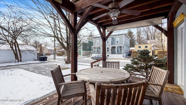 snow covered deck with ceiling fan