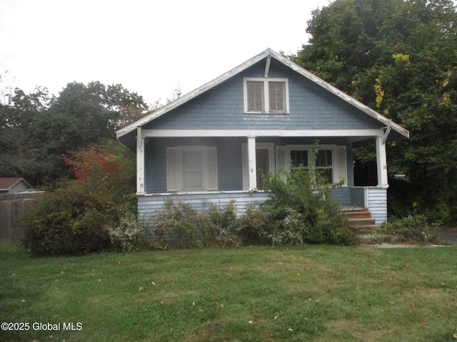 view of front of home featuring a porch and a front yard