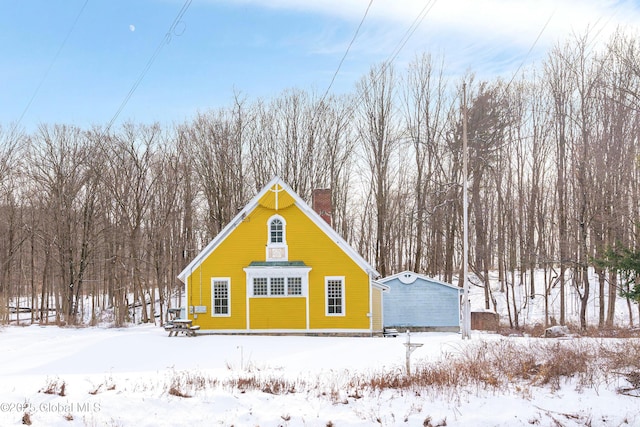 view of snow covered house