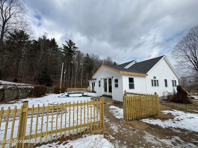 view of snow covered house