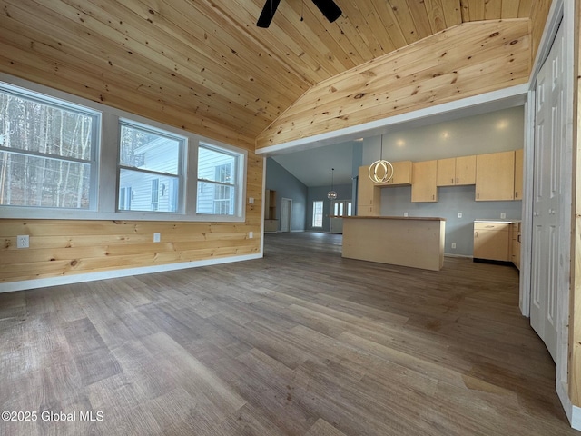 kitchen featuring wood-type flooring, light brown cabinets, wooden ceiling, and high vaulted ceiling