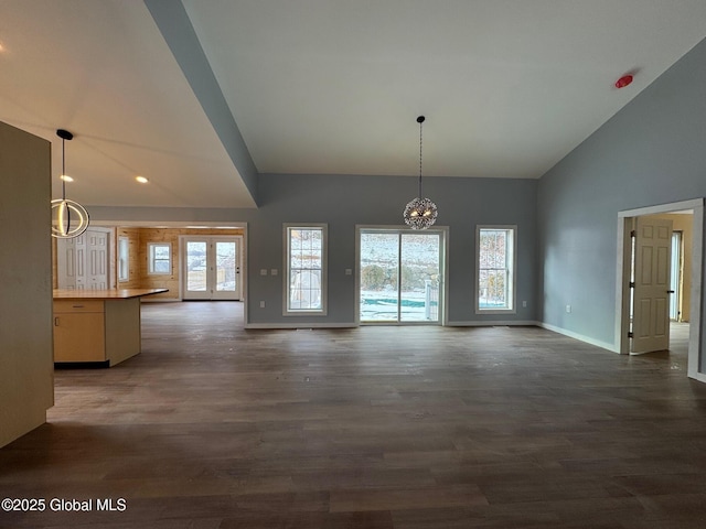 interior space featuring dark hardwood / wood-style flooring and vaulted ceiling