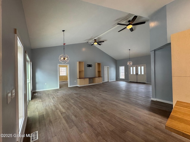 unfurnished living room featuring beam ceiling, high vaulted ceiling, ceiling fan with notable chandelier, and dark hardwood / wood-style flooring