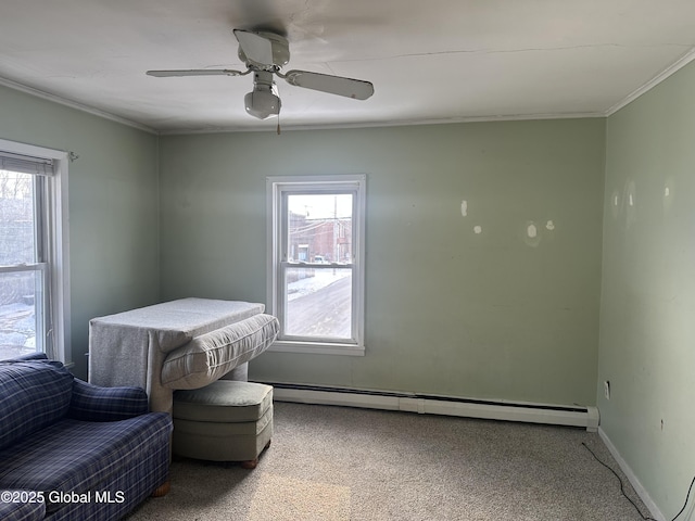 interior space with ceiling fan, ornamental molding, and baseboard heating