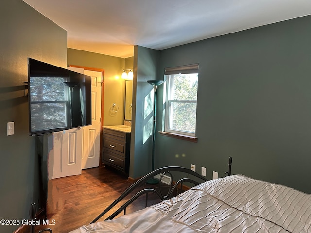 bedroom featuring dark hardwood / wood-style flooring