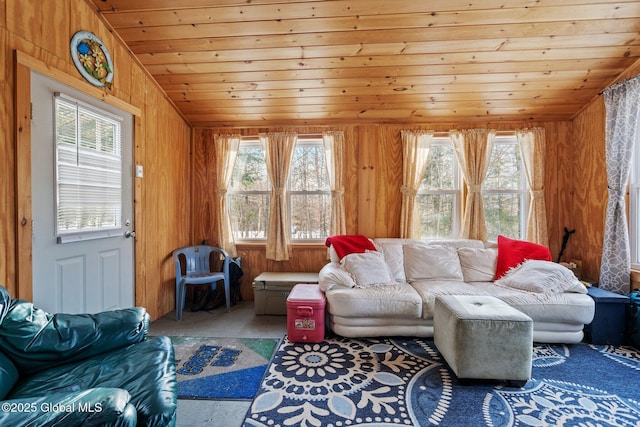 living room featuring wood ceiling, vaulted ceiling, and wood walls