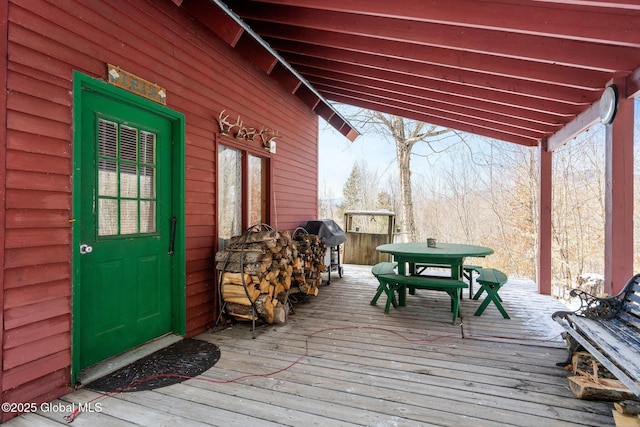 wooden terrace featuring area for grilling