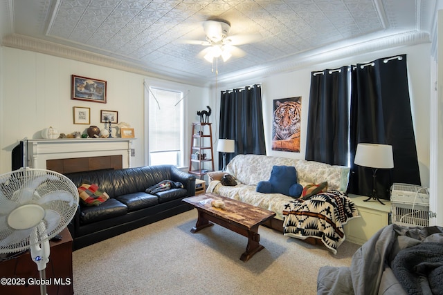 carpeted living room with ceiling fan