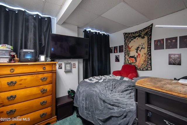 bedroom with a paneled ceiling