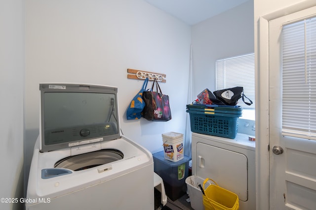 laundry room with washing machine and clothes dryer