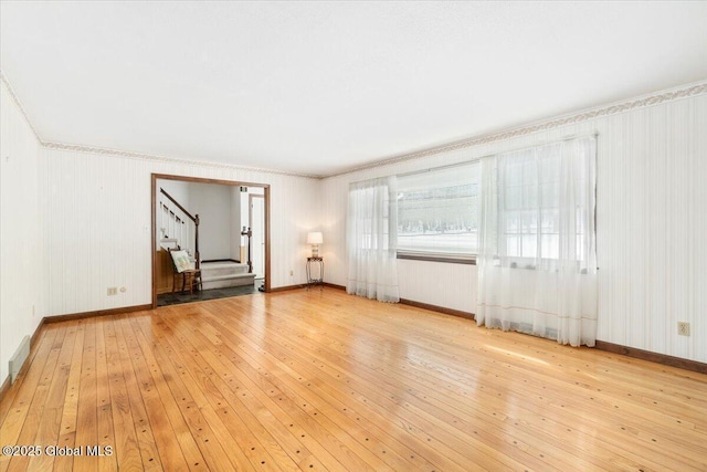 unfurnished living room with light hardwood / wood-style floors