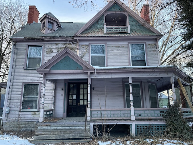 victorian house featuring covered porch