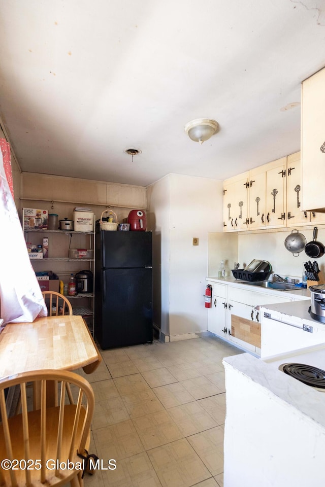 kitchen with black fridge