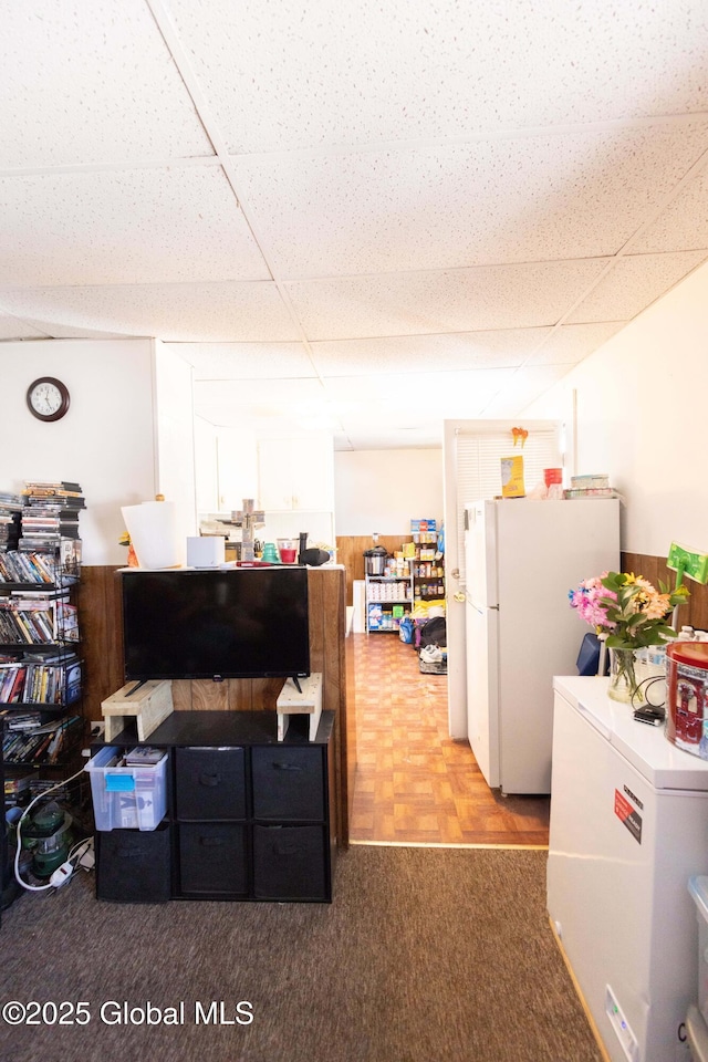 kitchen featuring a paneled ceiling, refrigerator, carpet, and white fridge