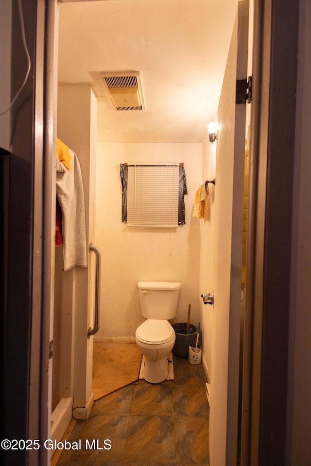 bathroom featuring toilet